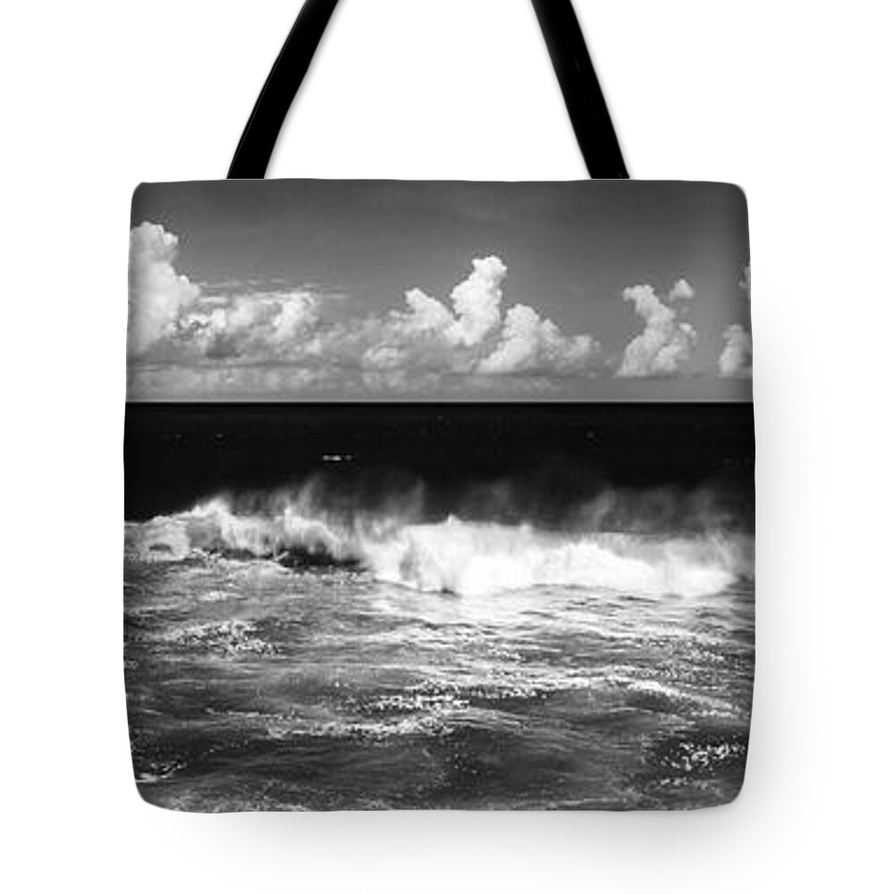 Panorama Tote Bag featuring the photograph Waves crashing in black and white by Sonny Ryse