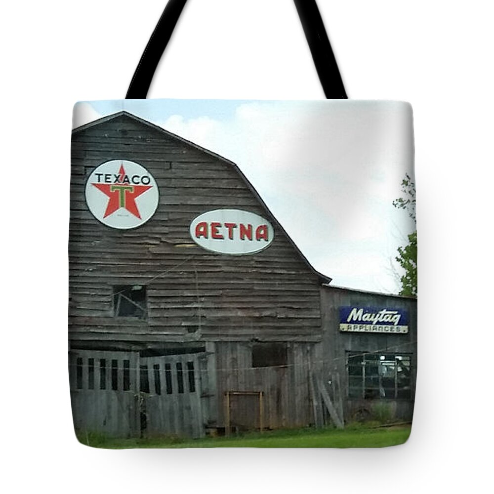 Old Tote Bag featuring the photograph Weathered Dilapidated Store or Barn with Vintage Signage by Ali Baucom
