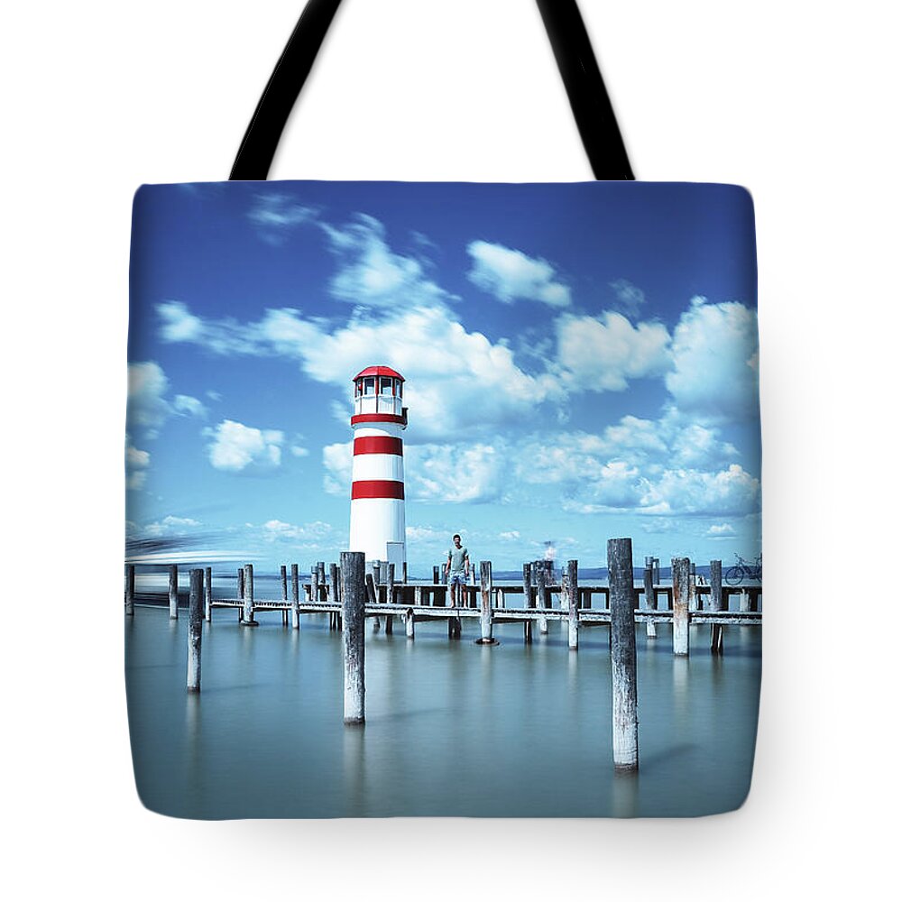 Destinations Tote Bag featuring the photograph White-red lighthouse in Podersdorf am See by Vaclav Sonnek
