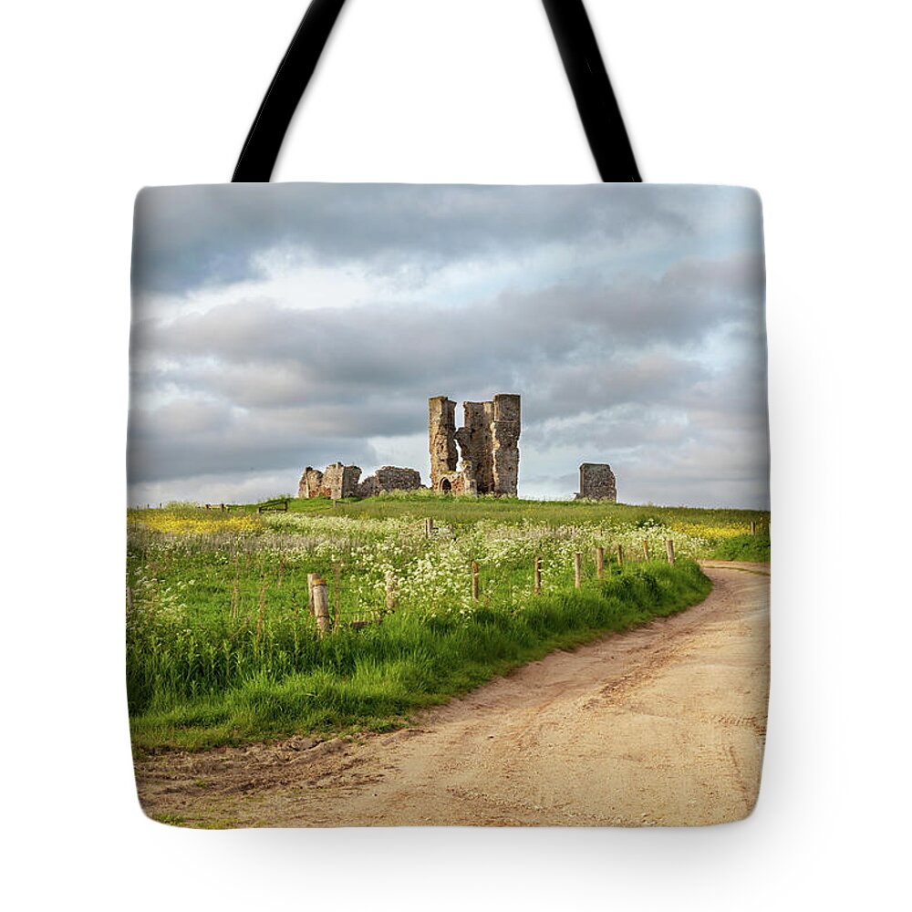 British Tote Bag featuring the photograph Winding road leading to a chirch ruin in Norfolk by Simon Bratt