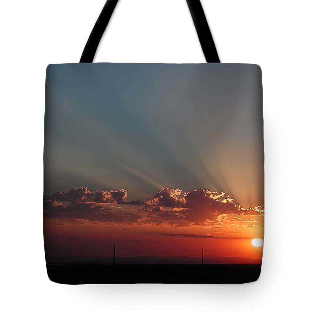 Sunrise Tote Bag featuring the photograph Winslow Sunrise by DArcy Evans