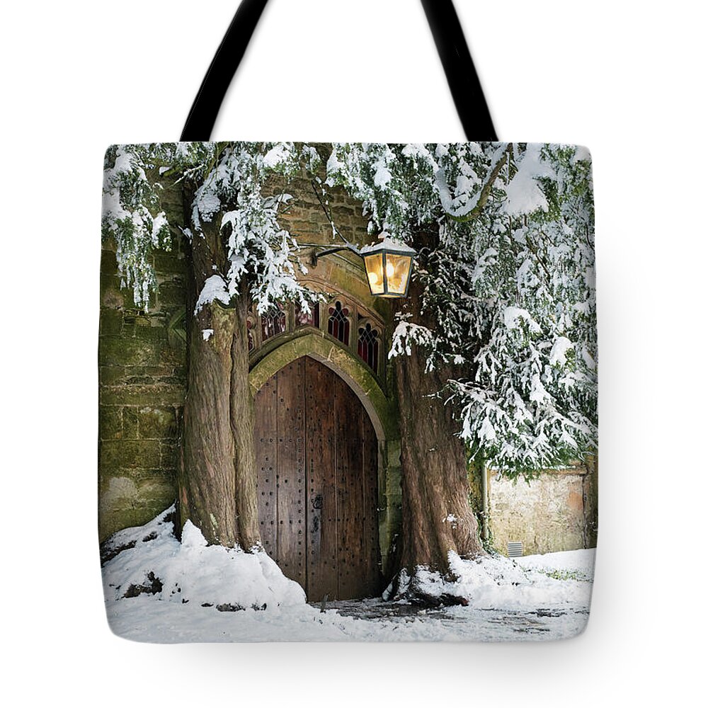 Stow On The Wold Tote Bag featuring the photograph Winter Yew Trees Stow on the Wold Church by Tim Gainey