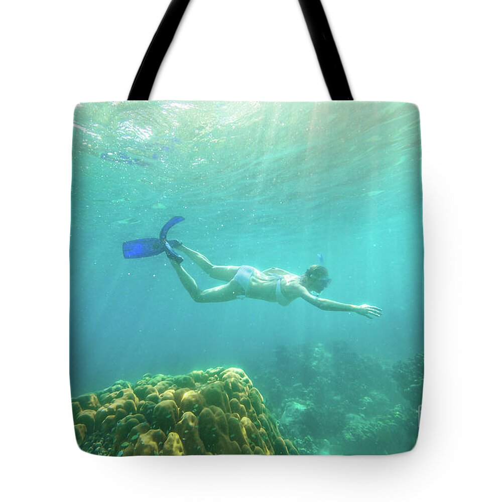 Snorkeling Tote Bag featuring the photograph Woman snorkeling Surin Islands by Benny Marty