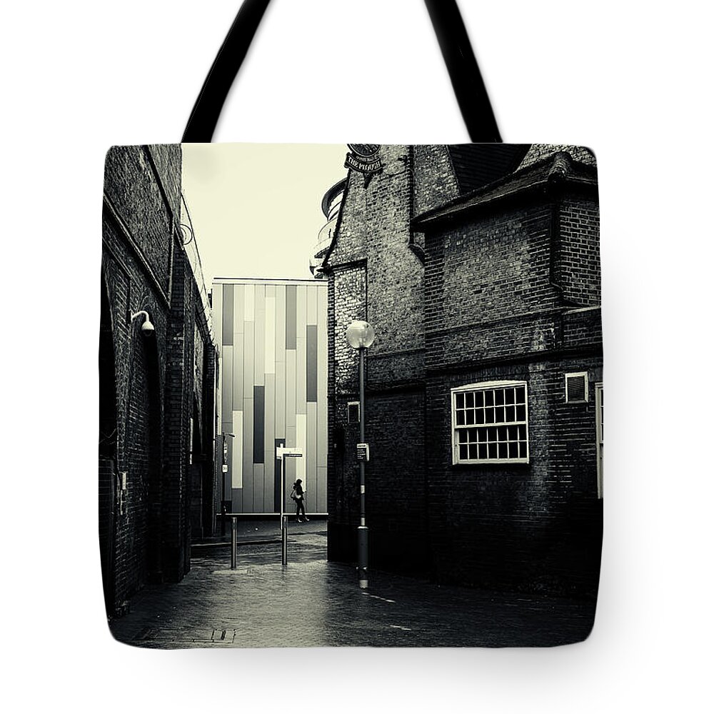 Urban Tote Bag featuring the photograph Woman Waiting in Rain by John Williams