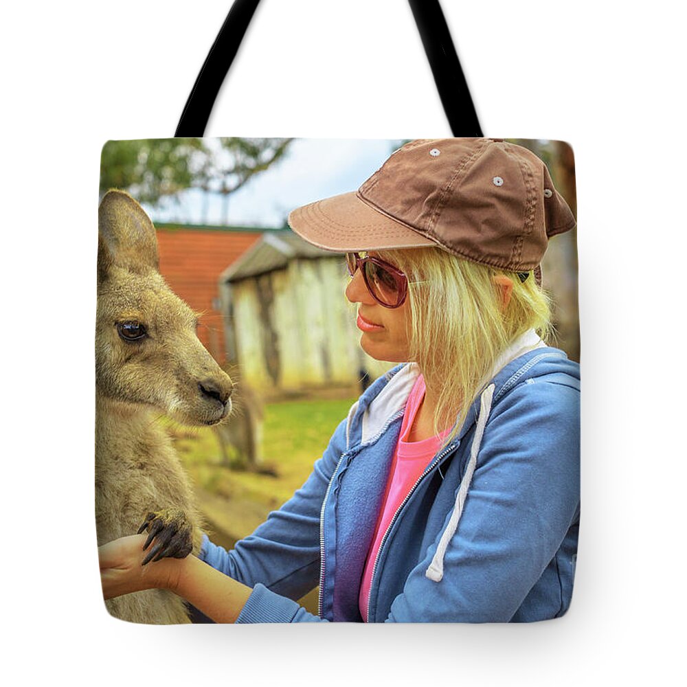 Kangaroos Tote Bag featuring the photograph Woman with kangaroo by Benny Marty