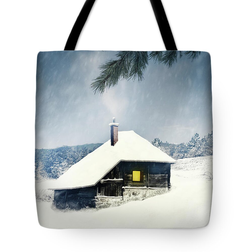 Lodge Tote Bag featuring the photograph Wooden house covered with snow in winter mountain landscape. by Jelena Jovanovic