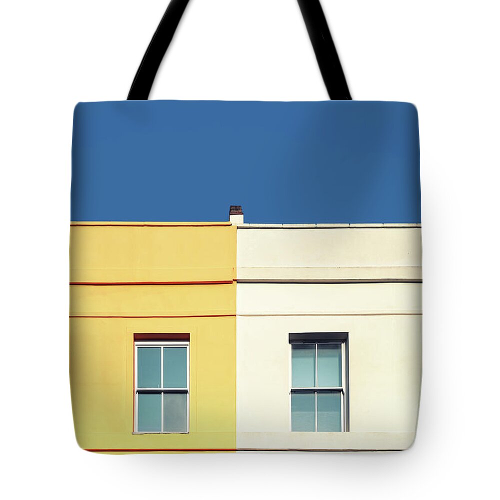Architecture Tote Bag featuring the photograph Yellow house, white house and blue sky. by Jane Rix