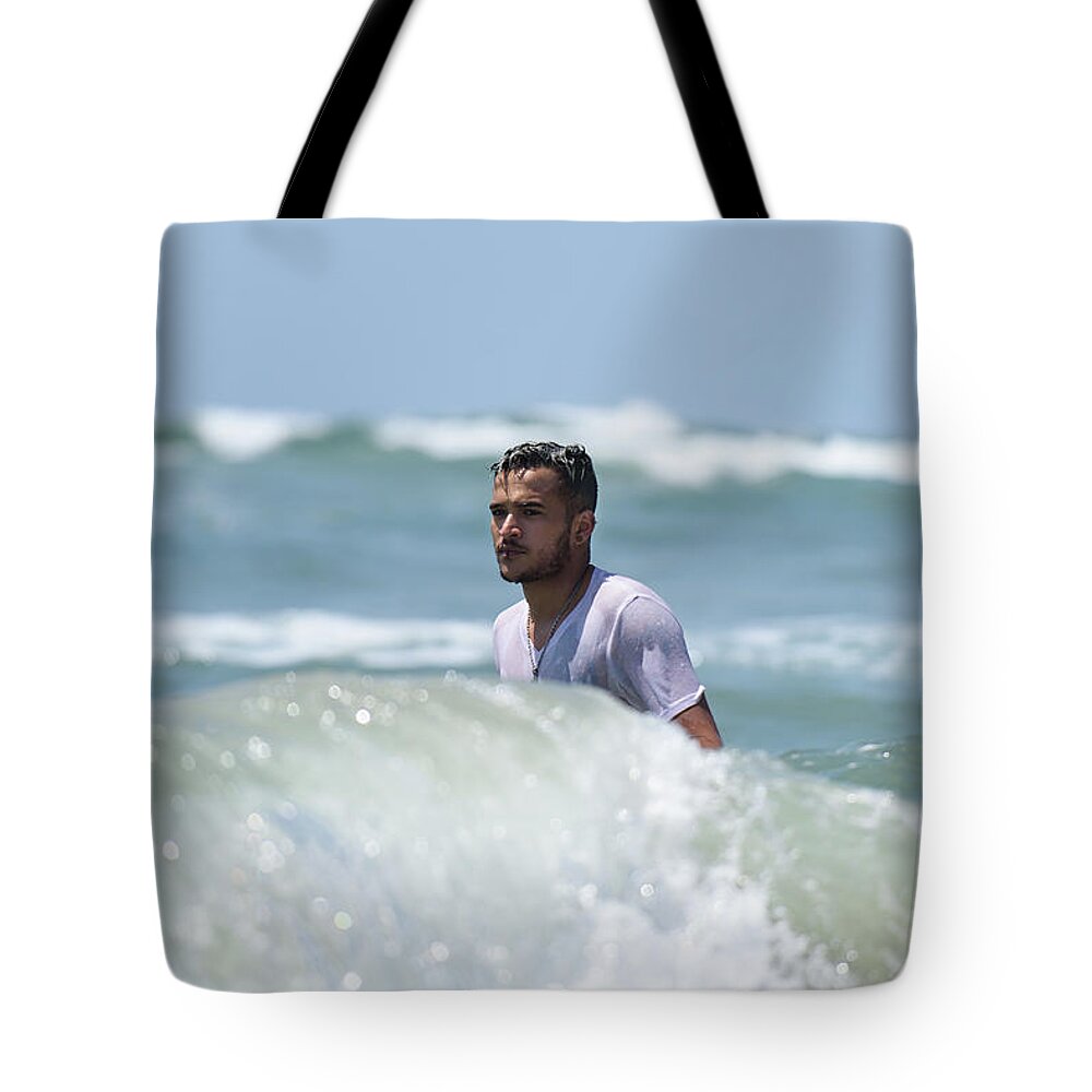 Man Tote Bag featuring the photograph Young Man Vacationing at Beach Stock Photo by Mark Stout