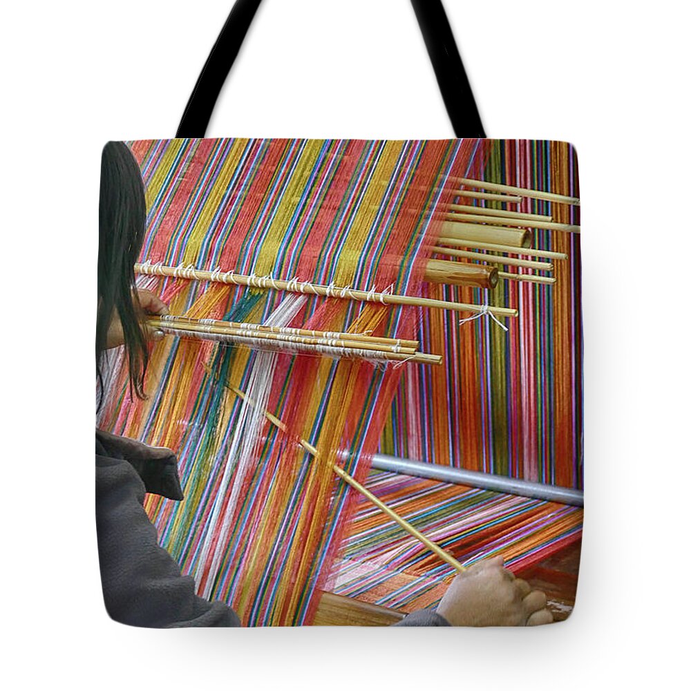 Bhutan Tote Bag featuring the photograph Young woman working a backstrap loom by Steve Estvanik