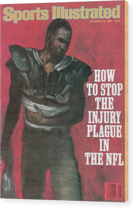 Magazine Cover Wood Print featuring the photograph How To Stop The Injury Plague In The Nfl Sports Illustrated Cover by Sports Illustrated
