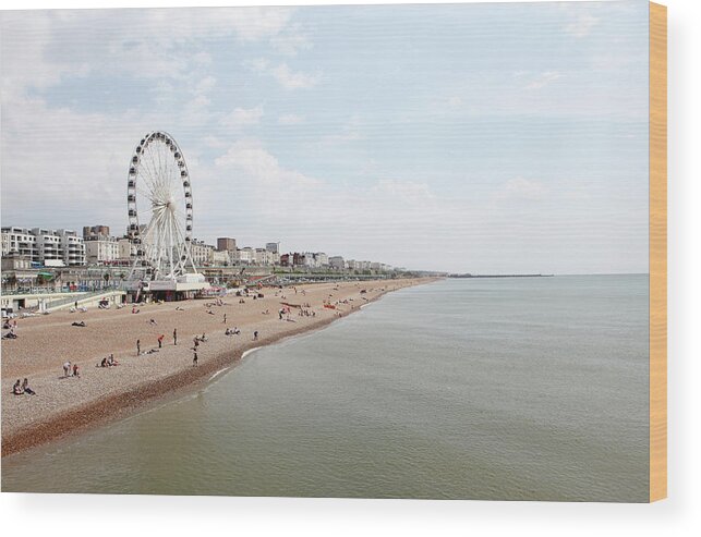 Water's Edge Wood Print featuring the photograph Brighton Beach #1 by Richard Newstead