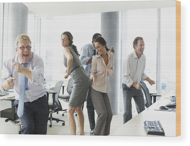 Working Wood Print featuring the photograph Businesspeople dancing in office #1 by Paul Bradbury