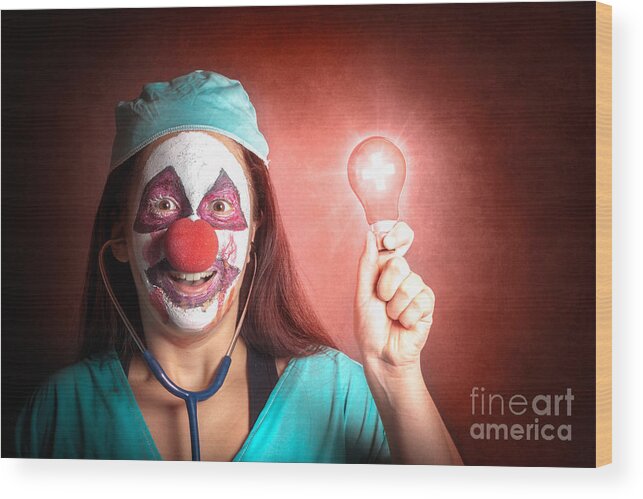 Clown Wood Print featuring the photograph Clown doctor holding red emergency lightbulb #1 by Jorgo Photography