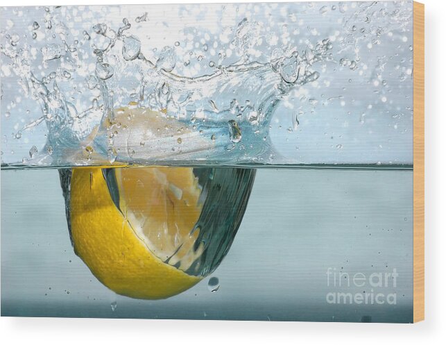 Aqua Wood Print featuring the photograph Lemon splash into water #1 by Michal Bednarek