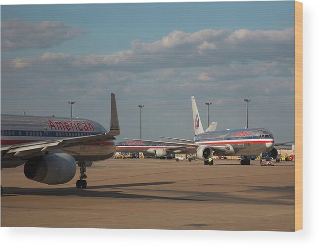Aircraft Wood Print featuring the photograph Passenger Airliners At An Airport #1 by Jim West