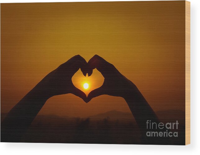 Abstract Wood Print featuring the photograph Silhouettes hand heart shaped #1 by Tosporn Preede