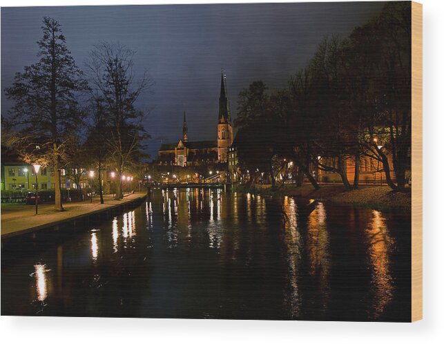 Uppsala By Night Wood Print featuring the photograph Uppsala by night by Torbjorn Swenelius