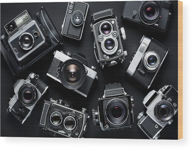 Black Background Wood Print featuring the photograph Vintage Cameras #1 by Jorg Greuel