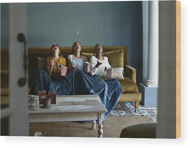 Adolescence Wood Print featuring the photograph 3 Friends Catching Popcorn With The Mouth by Klaus Vedfelt