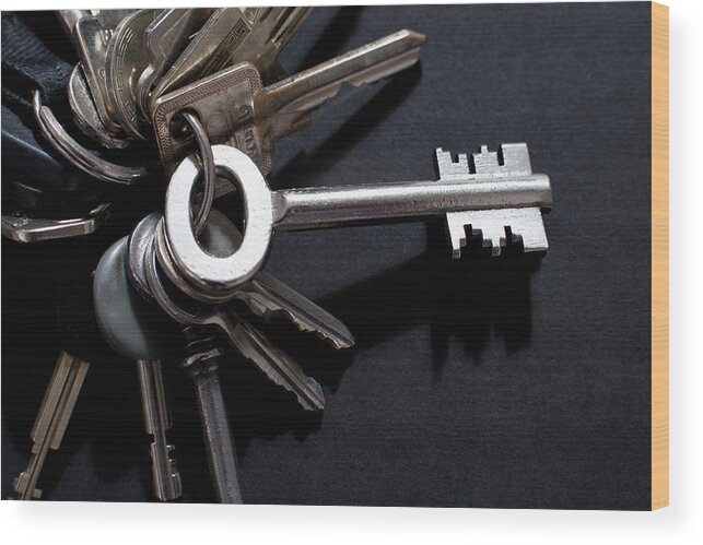 Security Wood Print featuring the photograph An Odd Shaped Old-fashioned Key by Larry Washburn