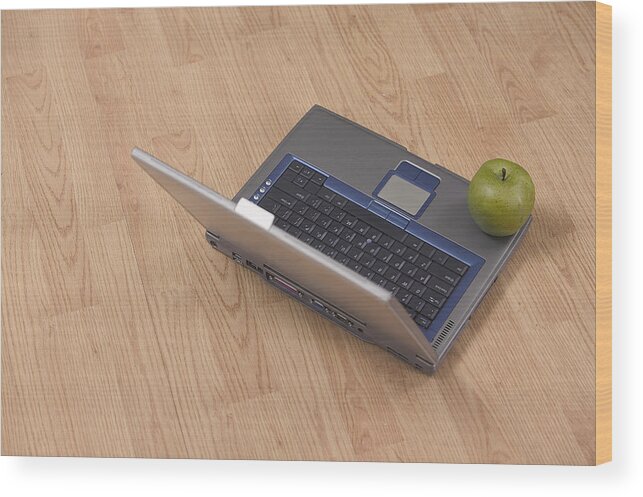 Computer Wood Print featuring the photograph Apple on laptop by Comstock Images