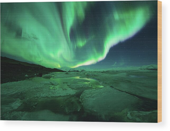 Glacier Lagoon Wood Print featuring the photograph Aurora Display Over The Glacier Lagoon by Natthawat