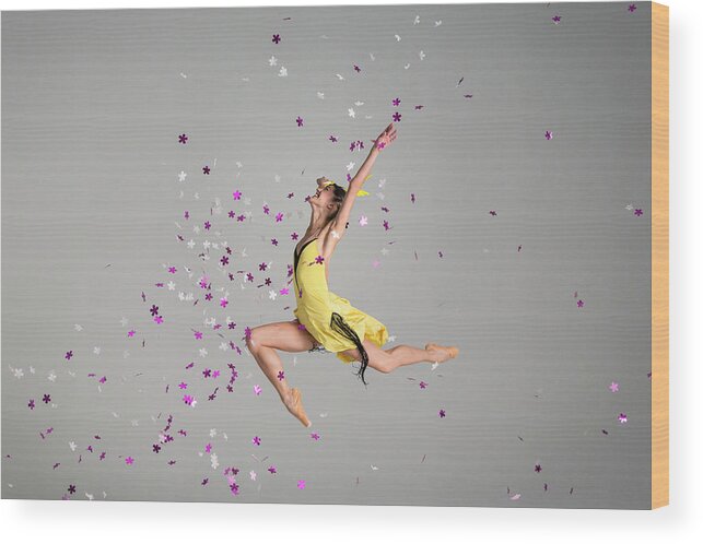 Ballet Dancer Wood Print featuring the photograph Ballerina Jumping Through Purple Flowers by Nisian Hughes