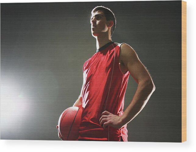 Orange Color Wood Print featuring the photograph Basketball Player Standing With Ball by Stanislaw Pytel