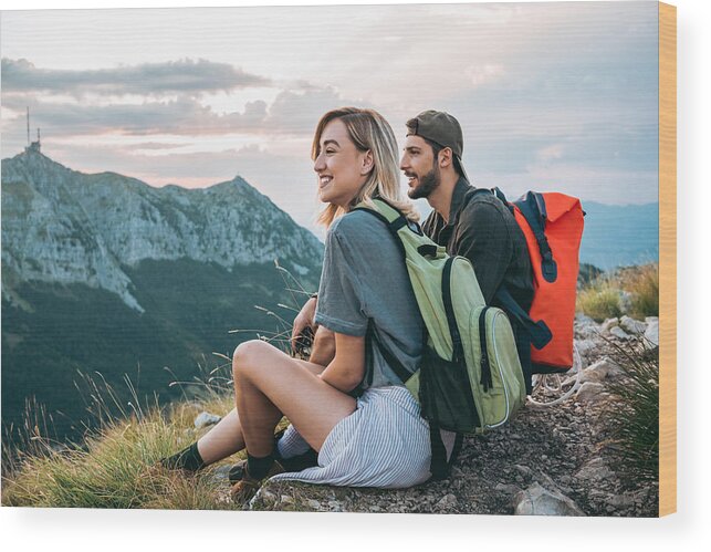 Young Men Wood Print featuring the photograph Beautiful Young Couple Relaxing After Hiking And Taking A Break by DaniloAndjus