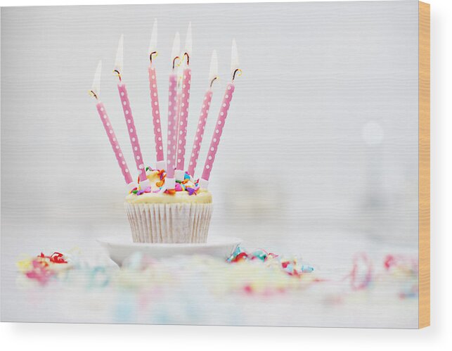 Celebration Wood Print featuring the photograph Birthday candles on cupcake by Robert Daly