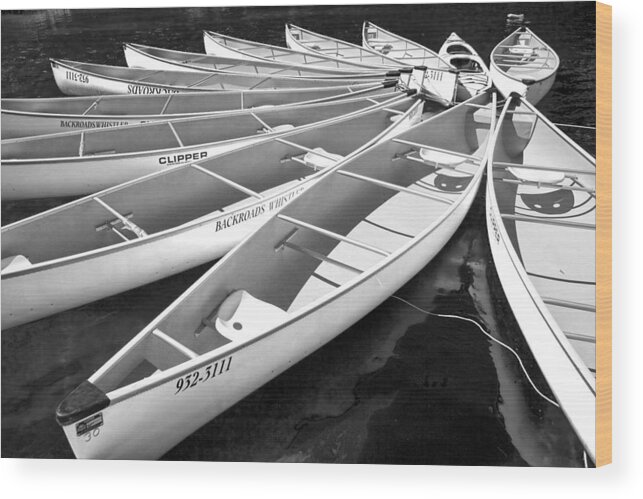 Black And White Wood Print featuring the photograph Black and White Photograph of a group of canoes tethered together in a circle by Randall Nyhof