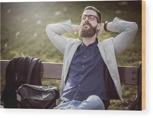 Young Men Wood Print featuring the photograph Businessman Relaxing On The Bench After Work by DaniloAndjus