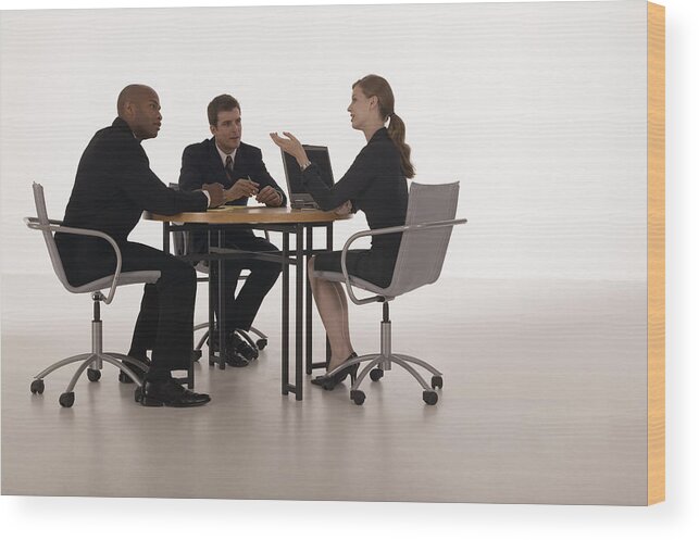 Mid Adult Women Wood Print featuring the photograph Businesspeople in meeting by Comstock Images