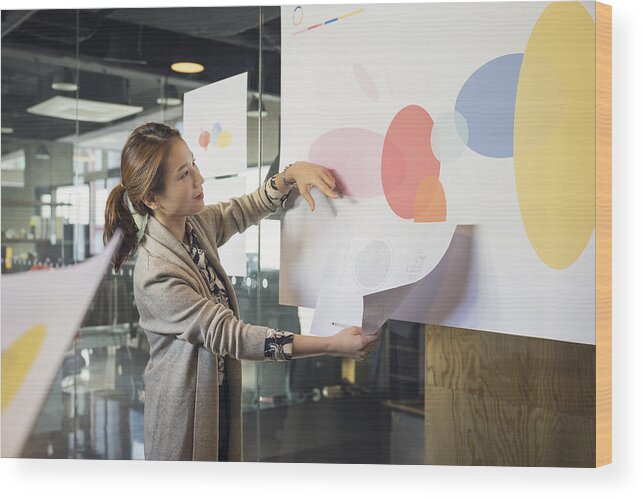 Expertise Wood Print featuring the photograph Businesswoman leading presentation in conference room by Sunwoo Jung