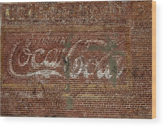 Coca Cola Wood Print featuring the photograph Coca Cola on Brick Wall by Bert Peake