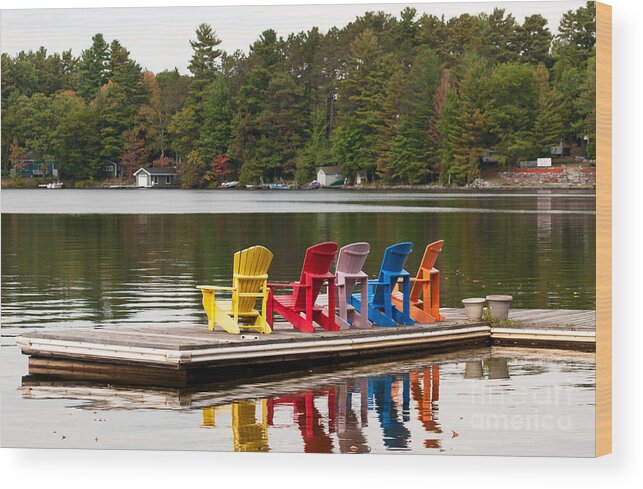 Five Wood Print featuring the photograph Colorful chairs at the lake by Les Palenik