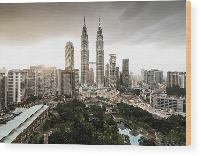 Built Structure Wood Print featuring the photograph Elevated View Of The Petronas Towers At by Martin Puddy