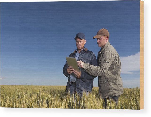 Farm Worker Wood Print featuring the photograph Farmers and Technology by Shotbydave