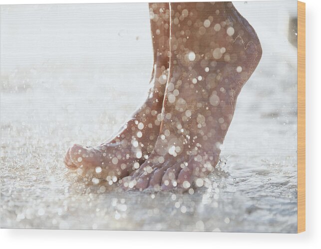 Shower Wood Print featuring the photograph Feet under shower outdoors by PhotoAlto/Odilon Dimier