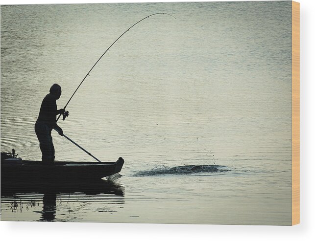 Fisher Wood Print featuring the photograph Fisherman Catching Fish On A Twilight Lake by Andreas Berthold