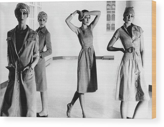 Beauty Wood Print featuring the photograph Four Models Standing In A Hallway by Deborah Turbeville