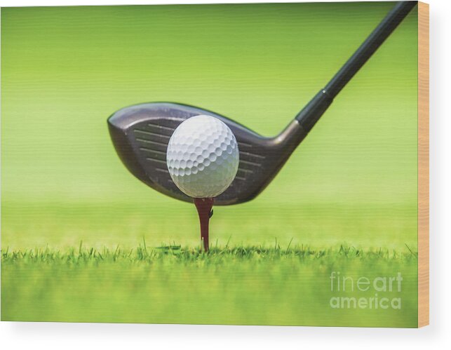 Golfing Wood Print featuring the photograph Golf ball behind driver at driving range by Anek Suwannaphoom