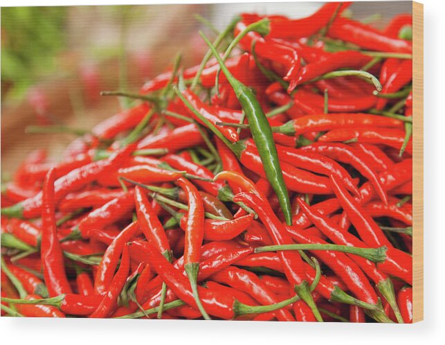 Heap Wood Print featuring the photograph Green Chili On A Heap Of Red Chilli by Dejan Patic