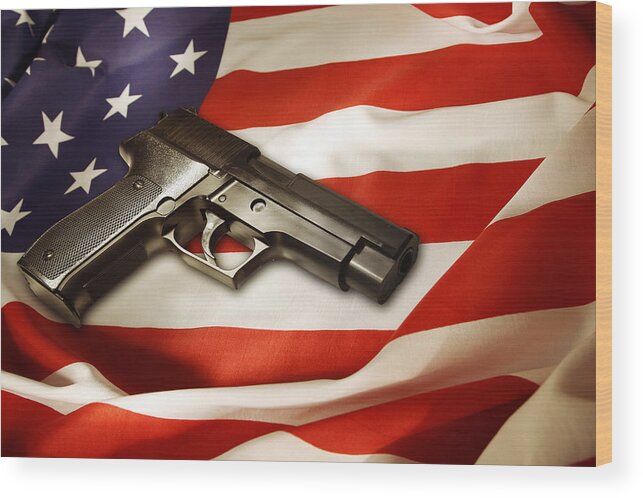 Gun Wood Print featuring the photograph Gun on flag by Les Cunliffe