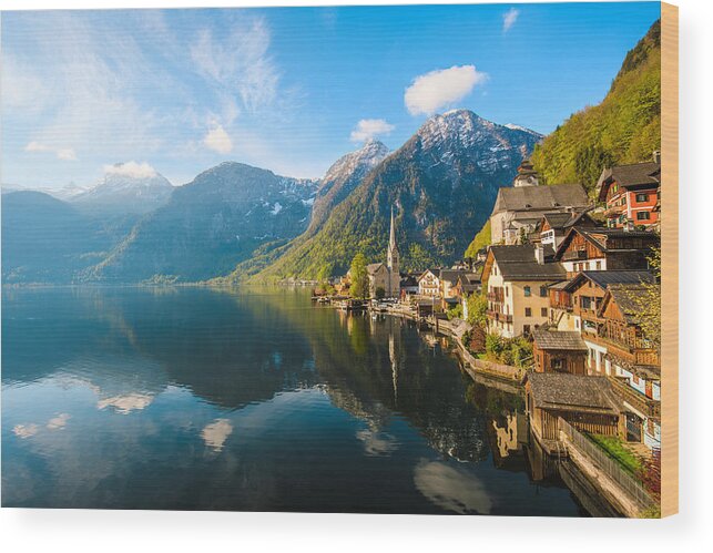 Water's Edge Wood Print featuring the photograph Hallstatt Village and Hallstatter See lake in Austria by Serts