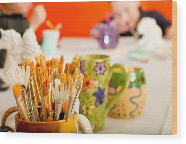 Working Wood Print featuring the photograph Hand painted Cup Full of Paintbrushes by Grandriver
