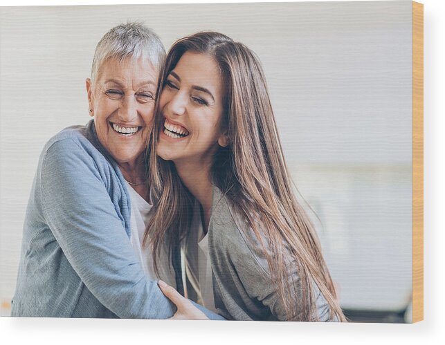 Bulgaria Wood Print featuring the photograph Happy adult mother and daughter embracing by Pixelfit