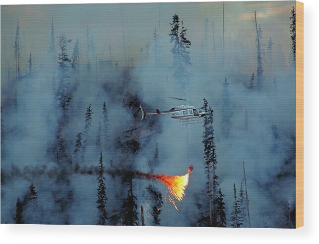 Helitorch Wood Print featuring the photograph Helitorch by Kari Greer/science Photo Library
