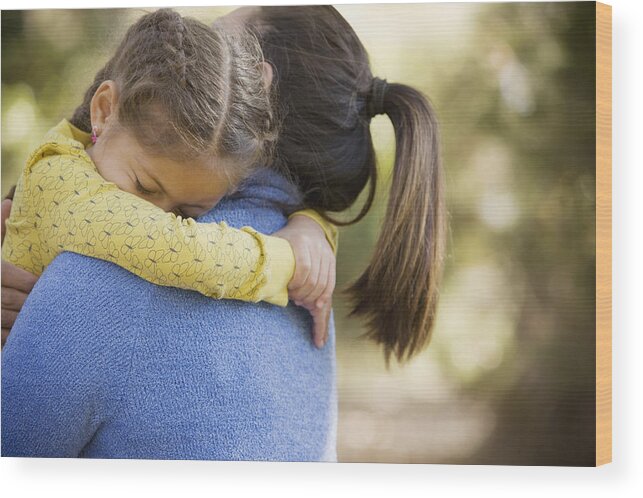 Problems Wood Print featuring the photograph Hispanic woman carrying daughter by Terry Vine