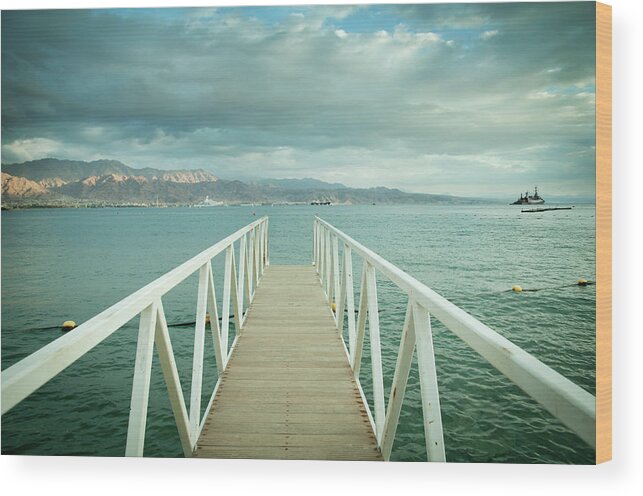 Water's Edge Wood Print featuring the photograph Jetty Into Red Sea by Nadzeya kizilava
